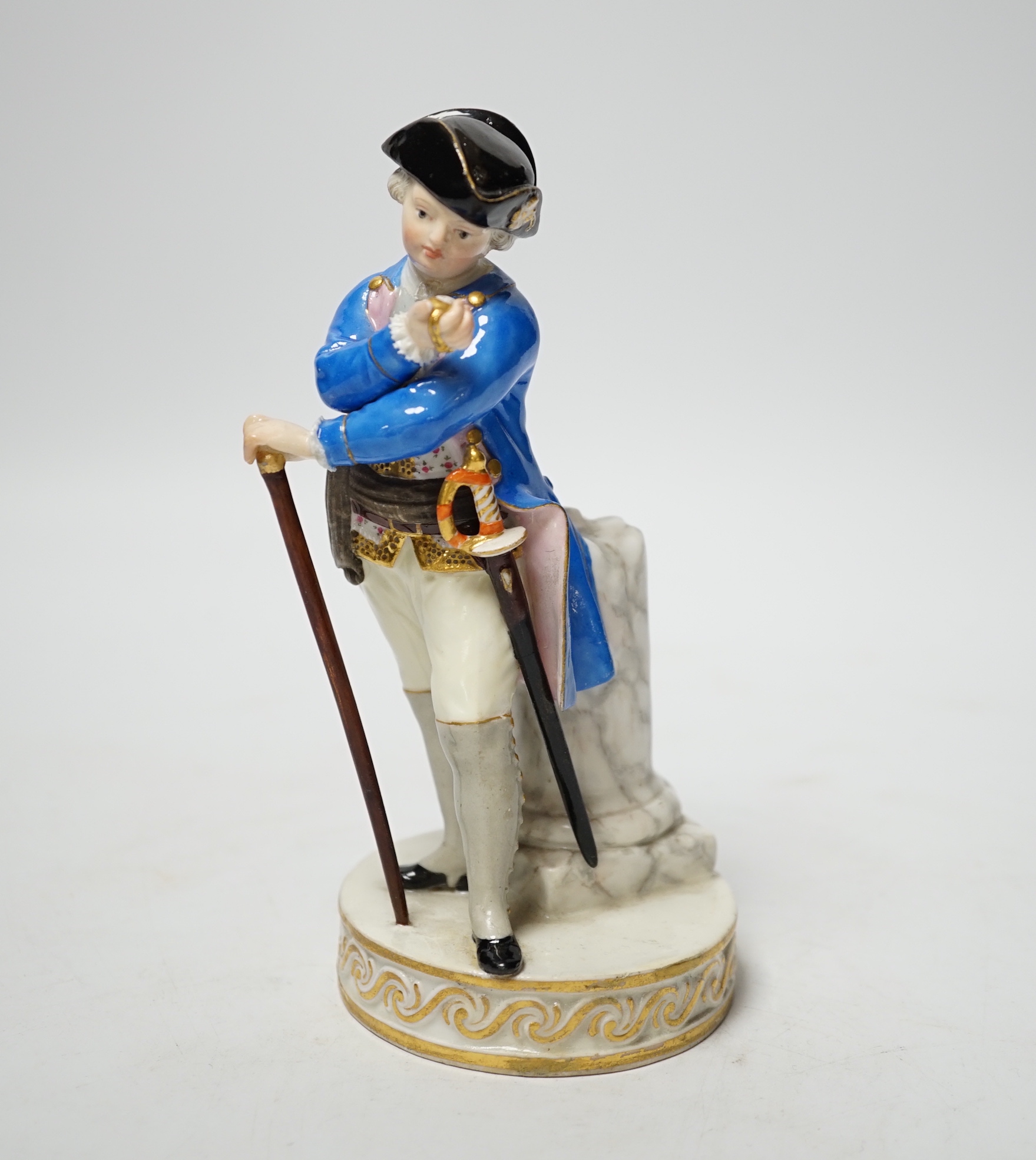 A late 19th century Meissen figure of an officer looking at his watch, incised F64 and impressed 122, 15cm